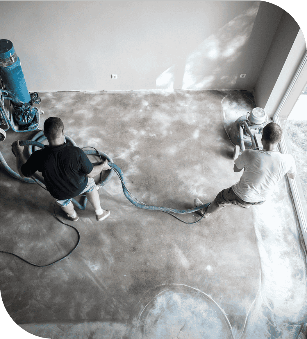 Two people are cleaning the floor